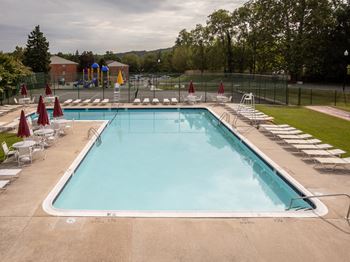 Large swimming pool with lounge area at Cromwell Valley Apartments in Towson, MD